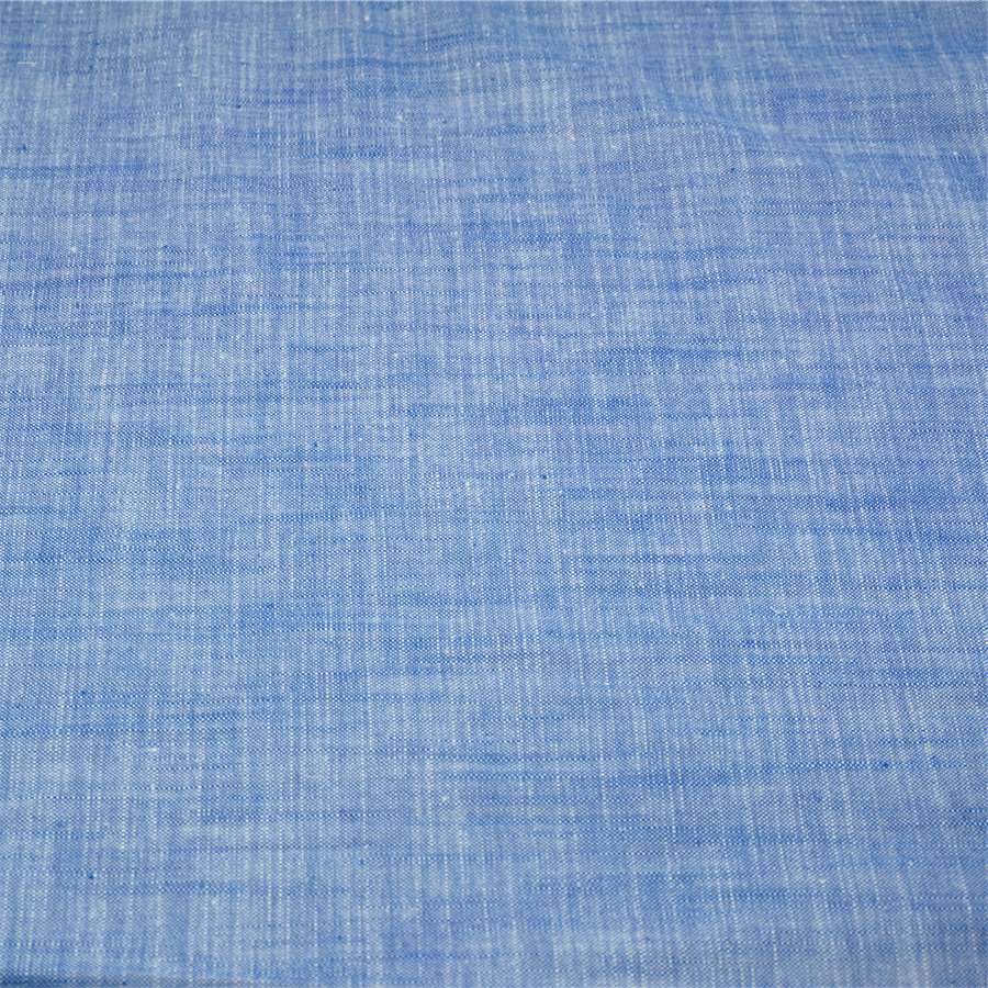 Slub chambray fabric in indigo blue color for summer